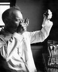 DUBOS IN HIS LABORATORY by The Rockefeller University